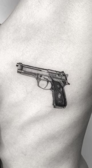 tatuaje de pistola 37
