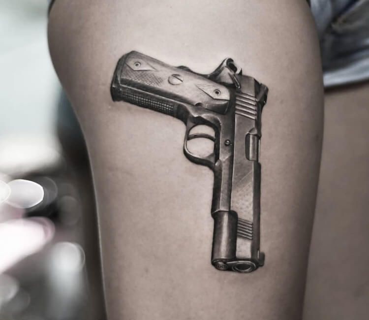 tatuaje de pistola 50